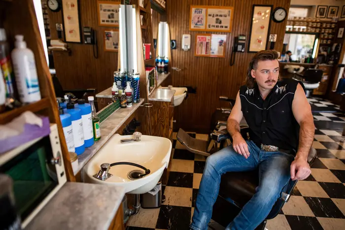 A photo of Morgan Wallen poses for a portrait after getting a haircut at Paul Mole Barber Shop, in New York